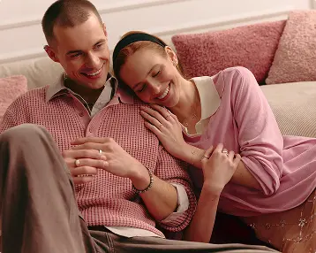 Two people playing cards on the bed